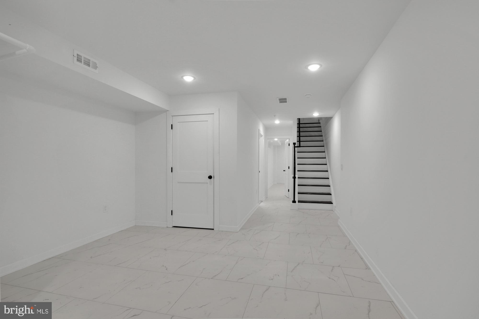 2670 Braddock Street Philadelphia, PA 19125 - Photo 14 of 47 a view of an empty room with a kitchen