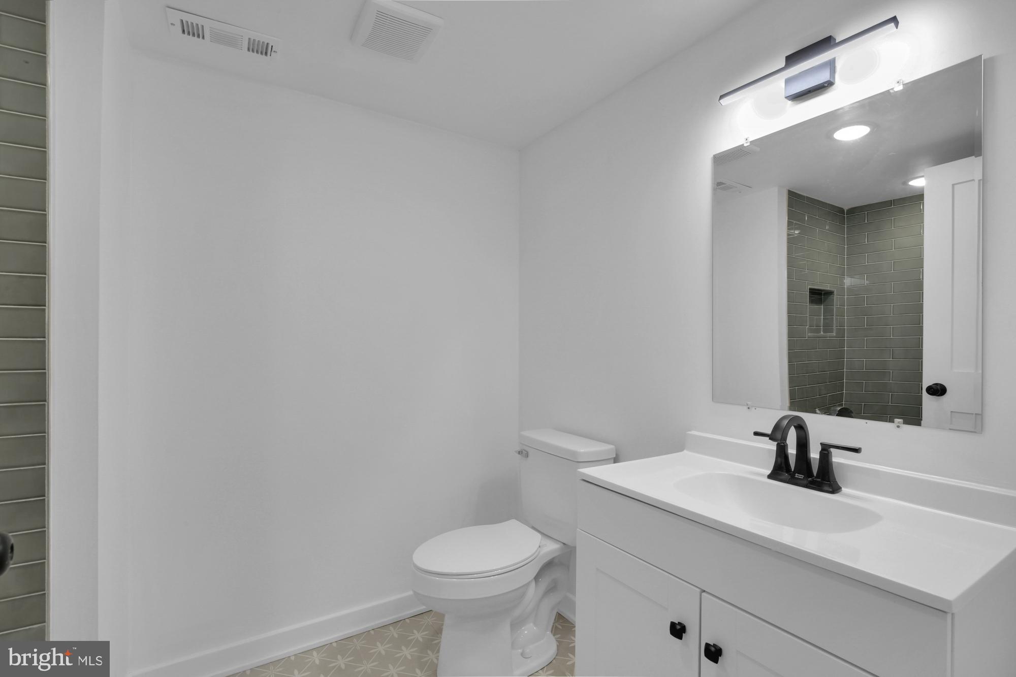 2670 Braddock Street Philadelphia, PA 19125 - Photo 15 of 47 a bathroom with a sink and a toilet