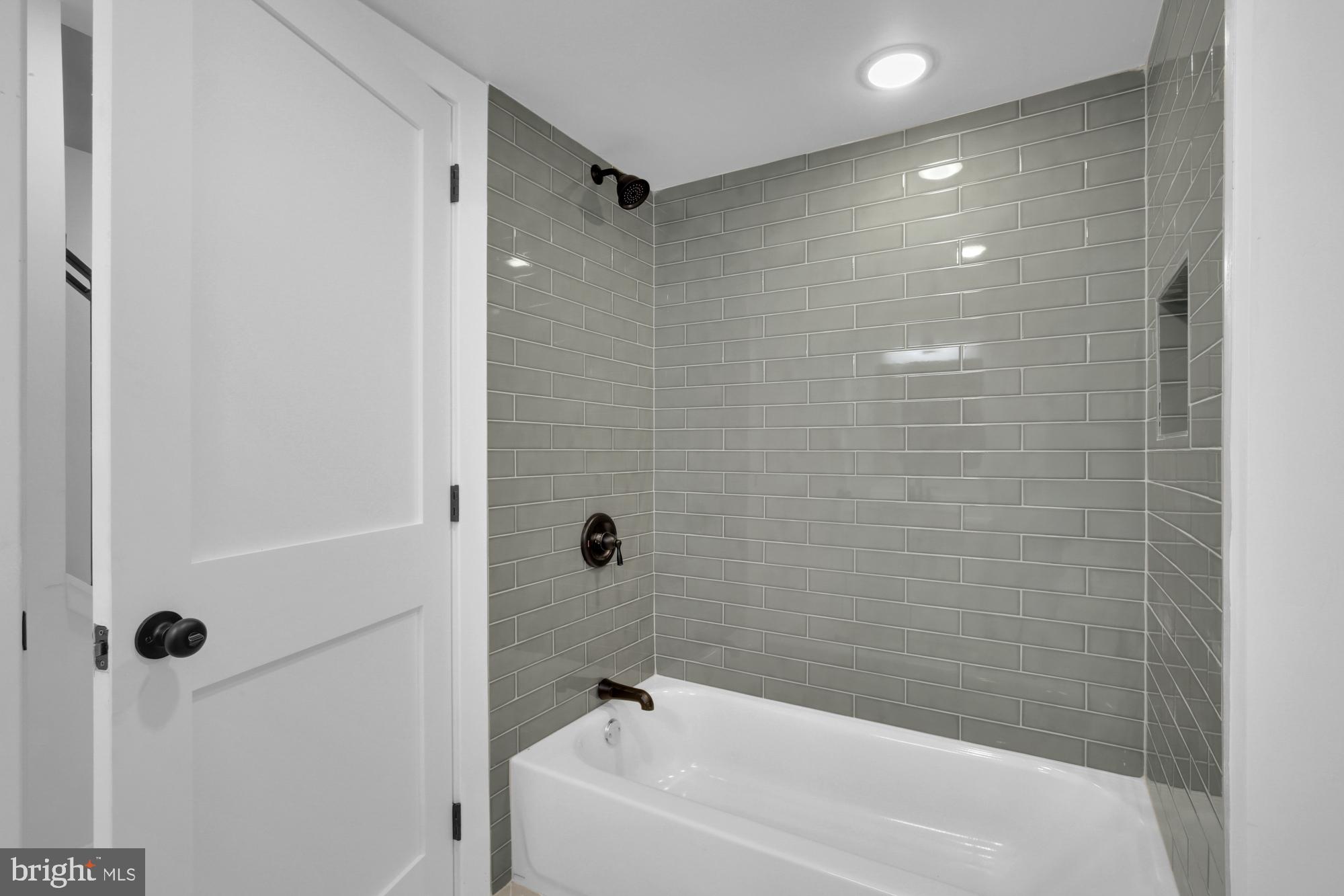 2670 Braddock Street Philadelphia, PA 19125 - Photo 16 of 47 a bathroom with a bathtub and shower