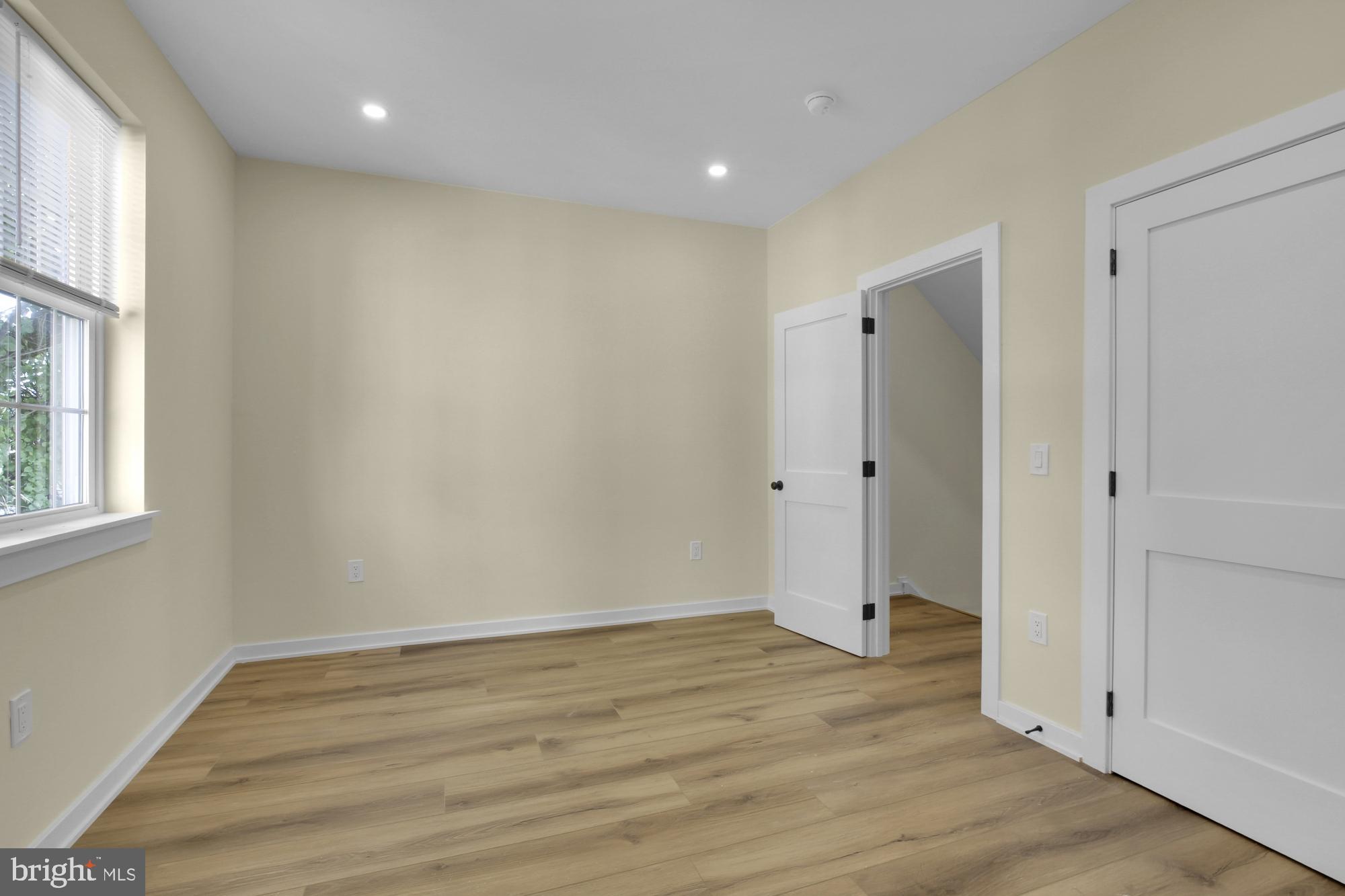 2670 Braddock Street Philadelphia, PA 19125 - Photo 22 of 47 wooden floor in an empty room with a window