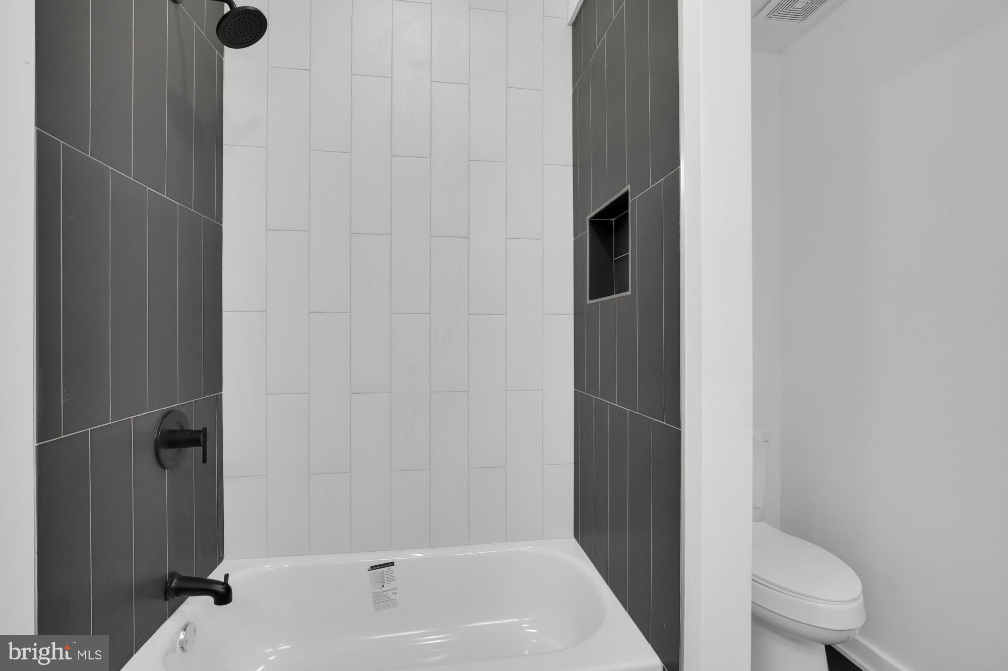 2670 Braddock Street Philadelphia, PA 19125 - Photo 24 of 47 a bathroom with a bathtub and toilet