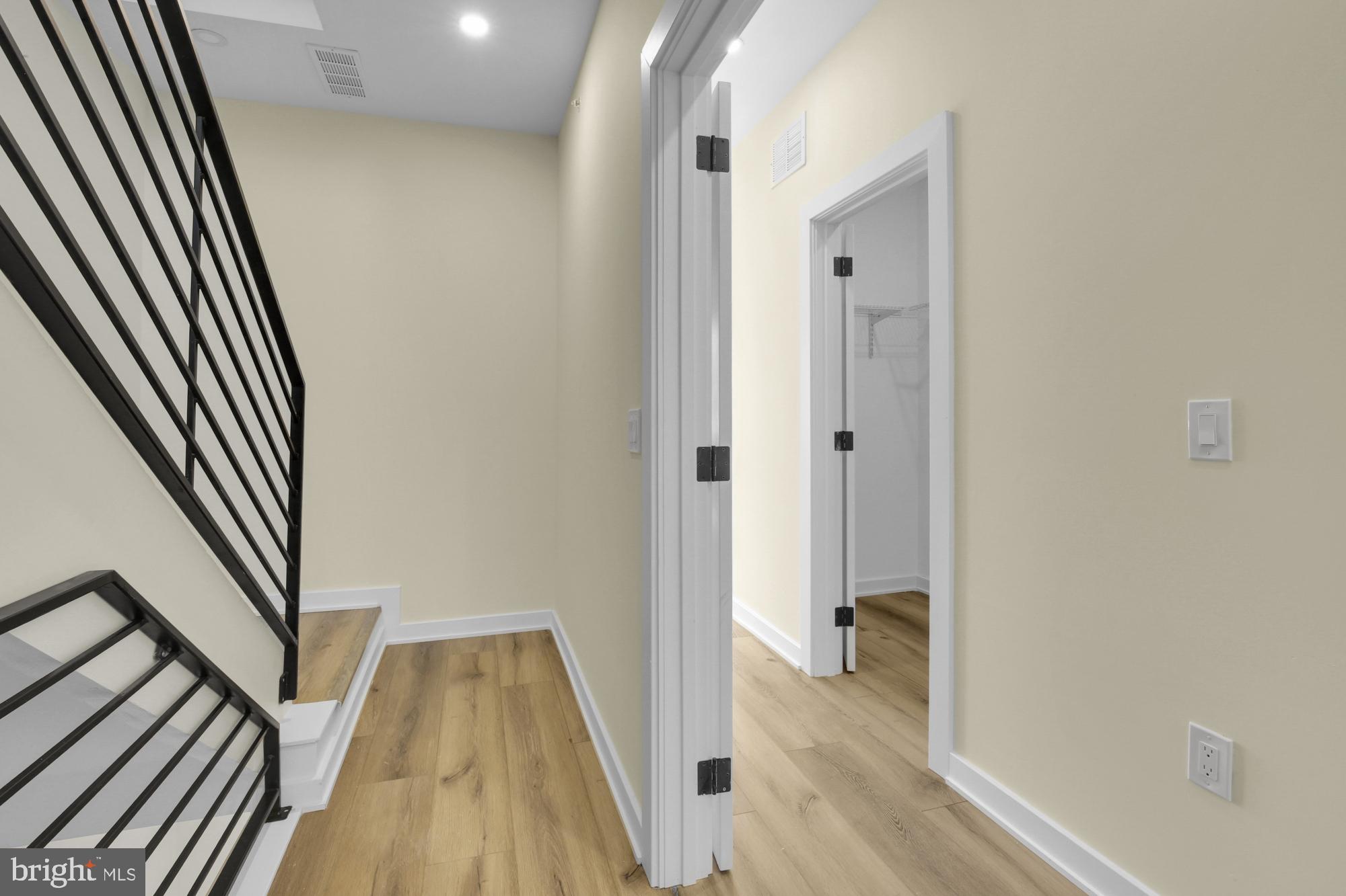 2670 Braddock Street Philadelphia, PA 19125 - Photo 31 of 47 a view of a hallway with wooden floor and staircase