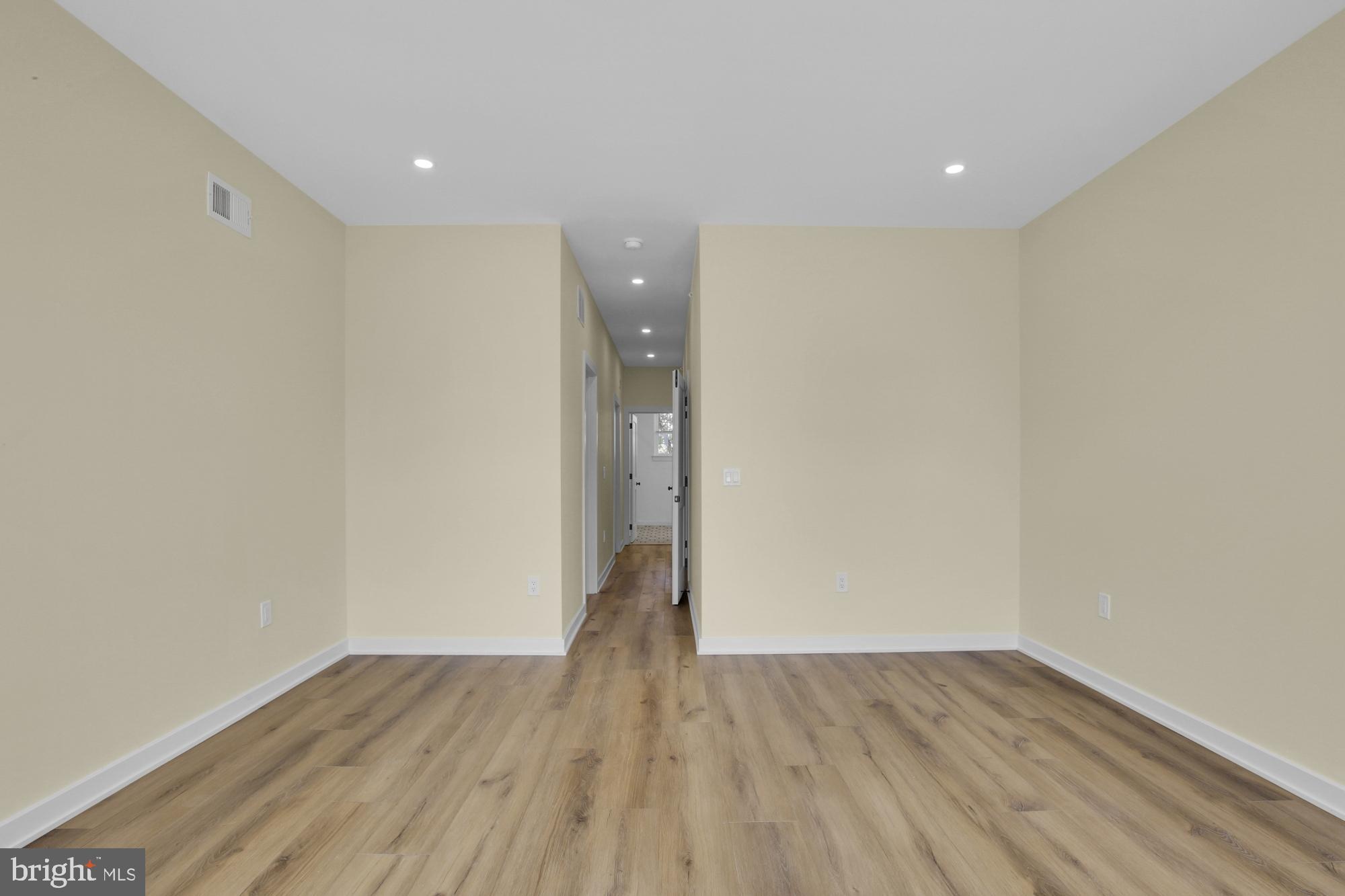 2670 Braddock Street Philadelphia, PA 19125 - Photo 34 of 47 a view of an empty room with wooden floor and a window