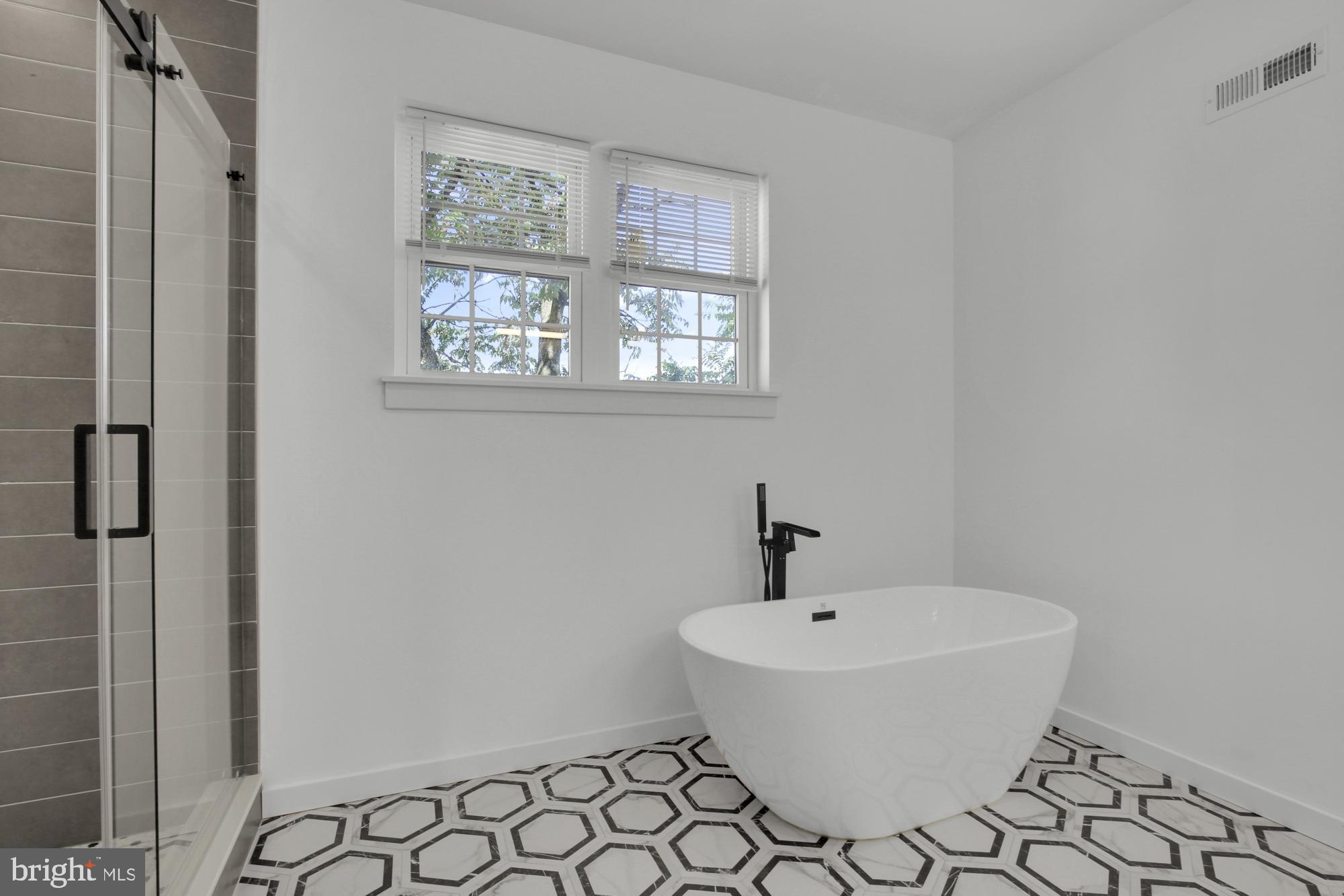 2670 Braddock Street Philadelphia, PA 19125 - Photo 38 of 47 a bathroom with a sink and a window