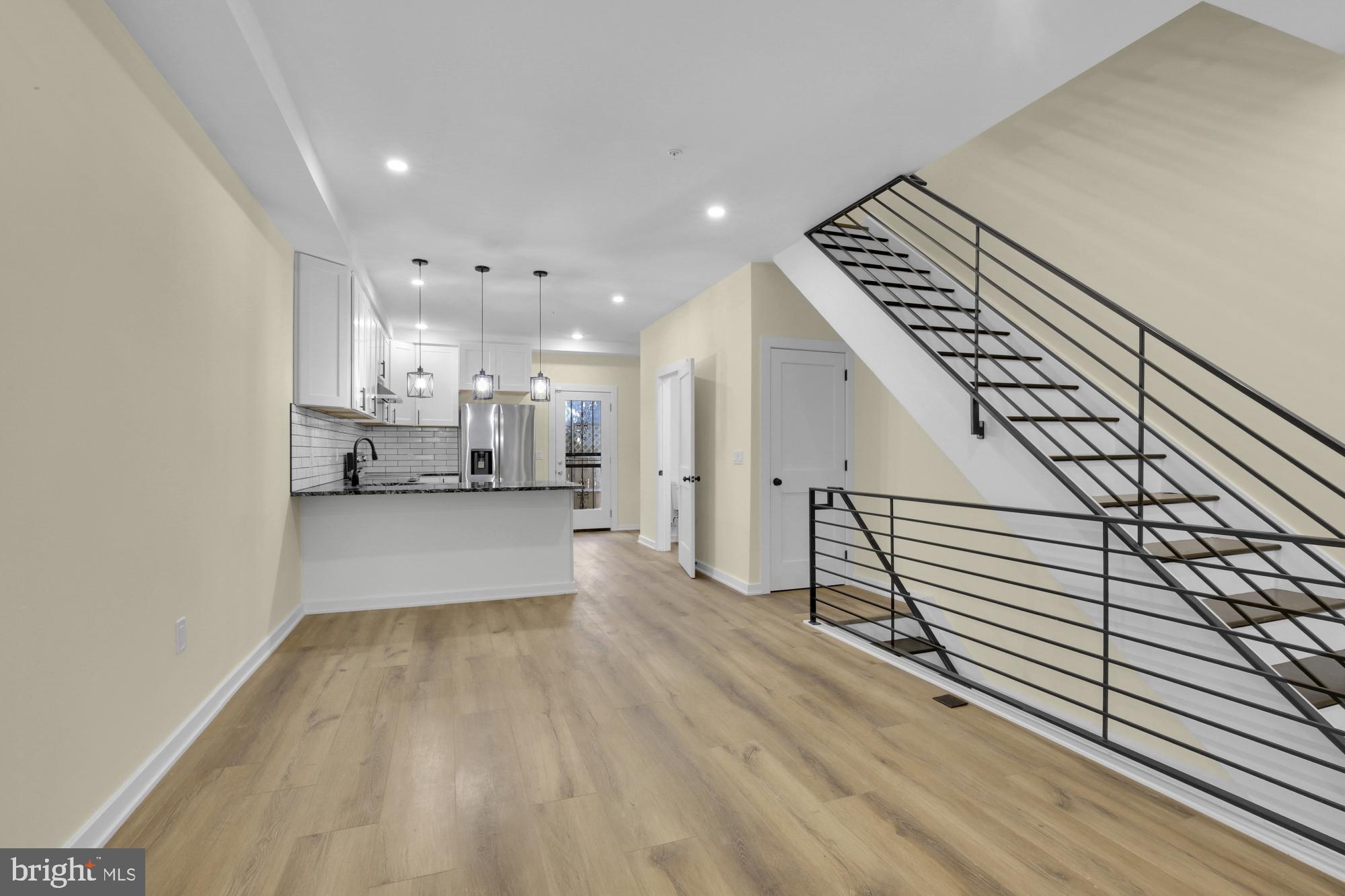 2670 Braddock Street Philadelphia, PA 19125 - Photo 6 of 47 a view of kitchen and hall with wooden floor
