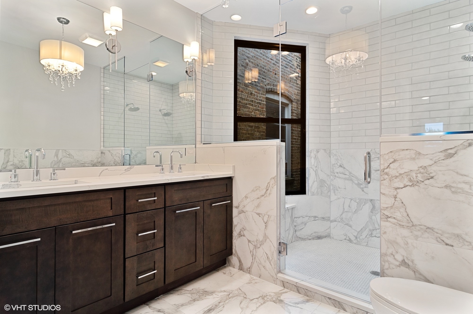 1211 West Addison Street, Unit 2 Chicago, IL 60613 - Photo 7 of 16 a bathroom with a sink a toilet and shower