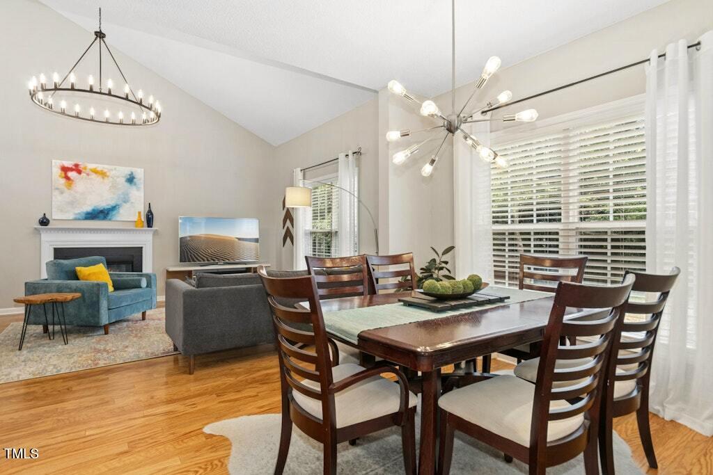 2342 School Creek Place Raleigh, NC 27606 - Photo 10 of 41 a view of a dining room with furniture window and wooden floor