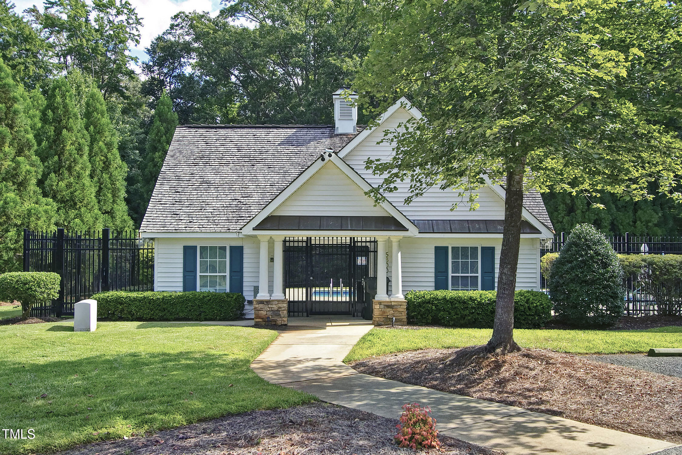 2342 School Creek Place Raleigh, NC 27606 - Photo 35 of 41 a front view of a house with garden