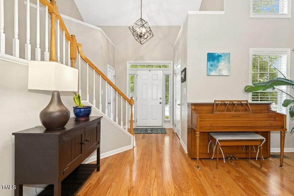 2342 School Creek Place Raleigh, NC 27606 - Photo 8 of 41 a living room with furniture and a wooden floor