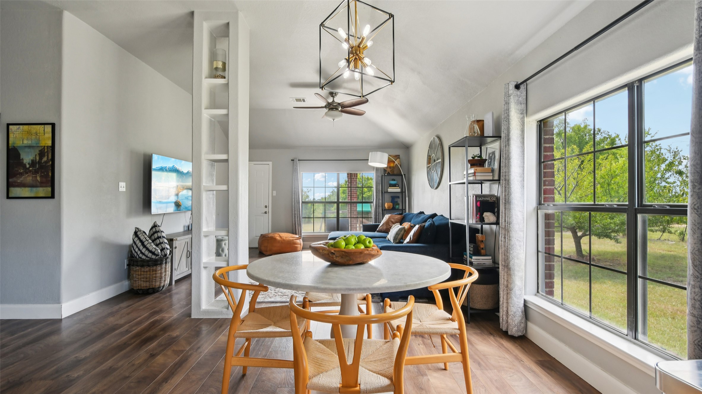 a view of a dining room with furniture window and wooden floor