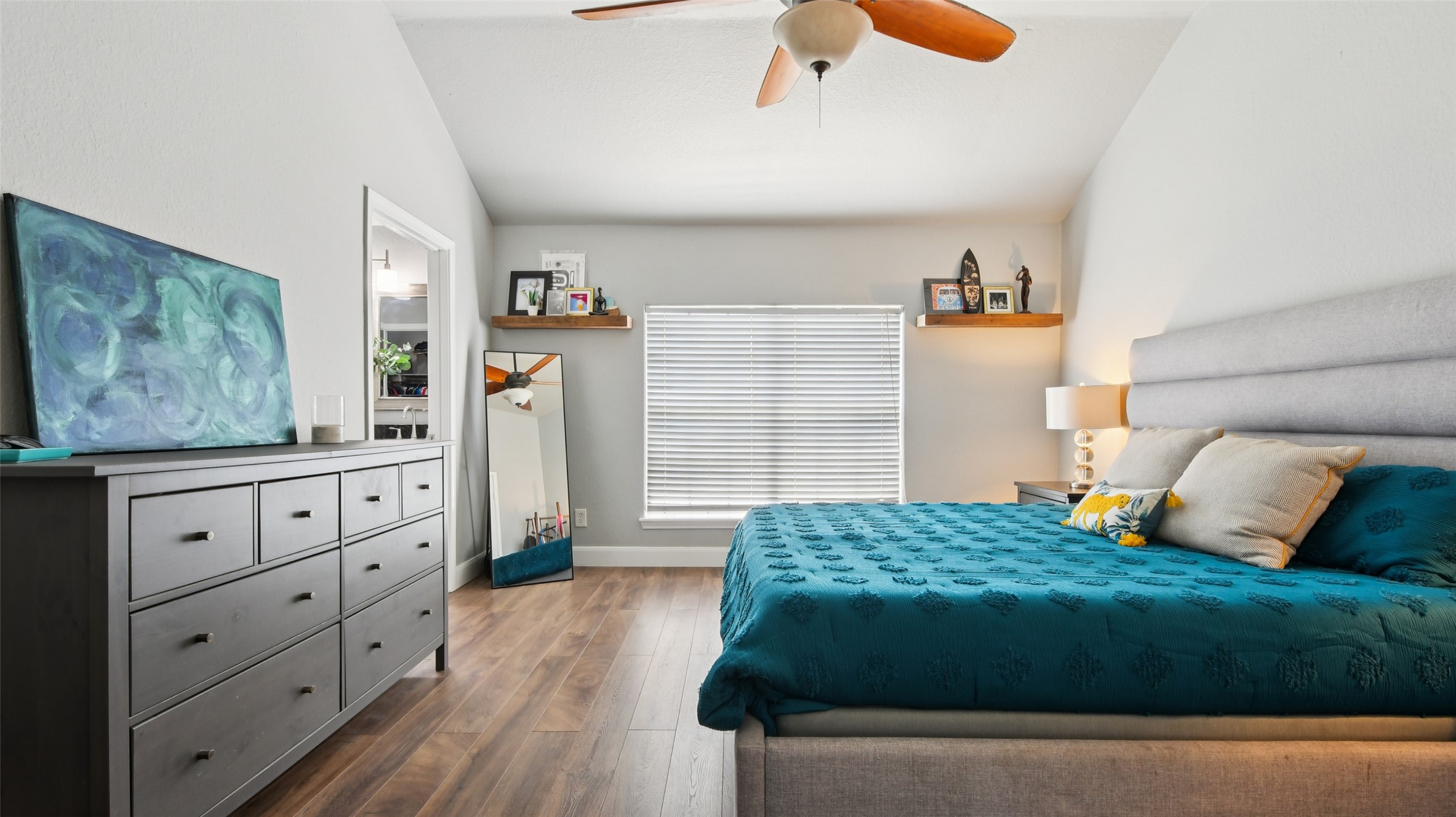 13131 Crane Road Buda, TX 78610 - Photo 14 of 18 a bedroom with a bed and a dresser