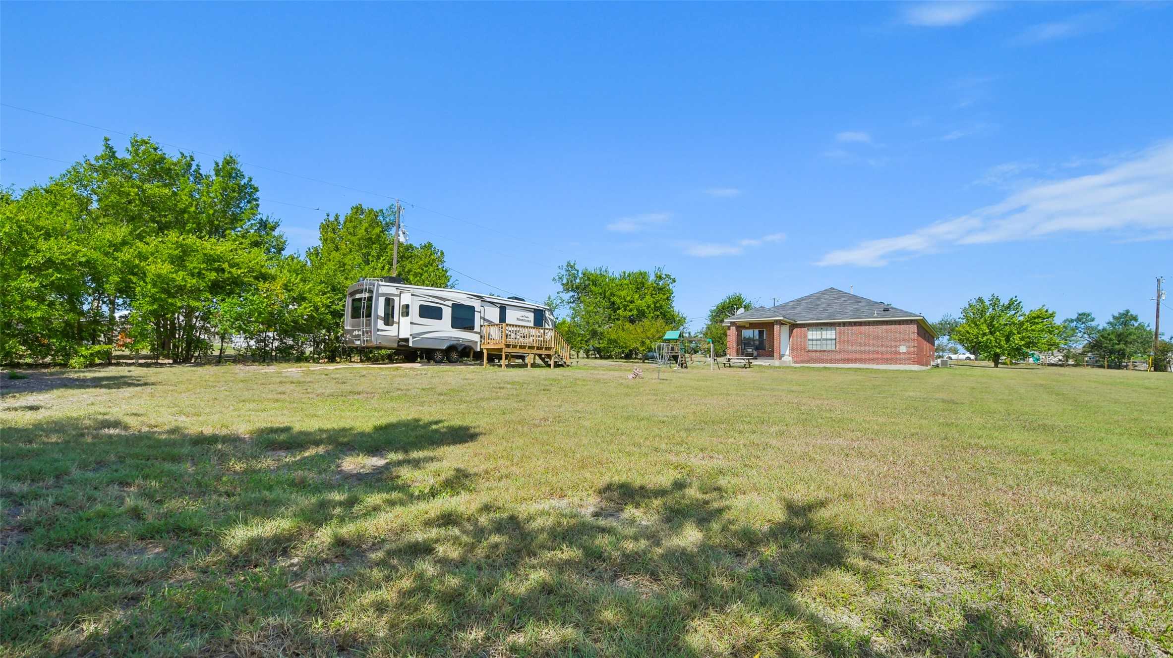 13131 Crane Road Buda, TX 78610 - Photo 16 of 18 a front view of a house with a yard
