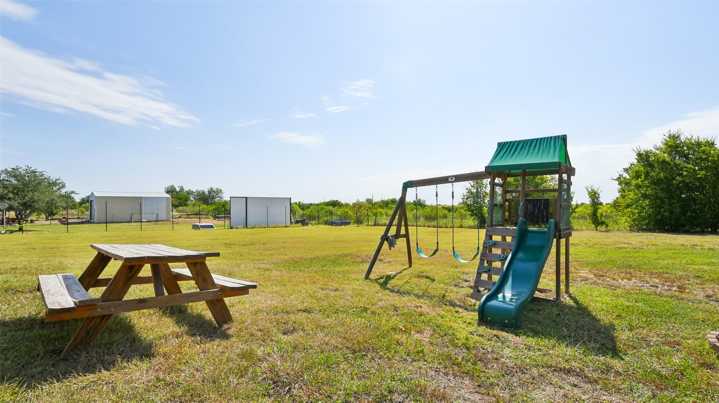13131 Crane Road Buda, TX 78610 - Photo 17 of 18 a swimming pool with some trees in the background