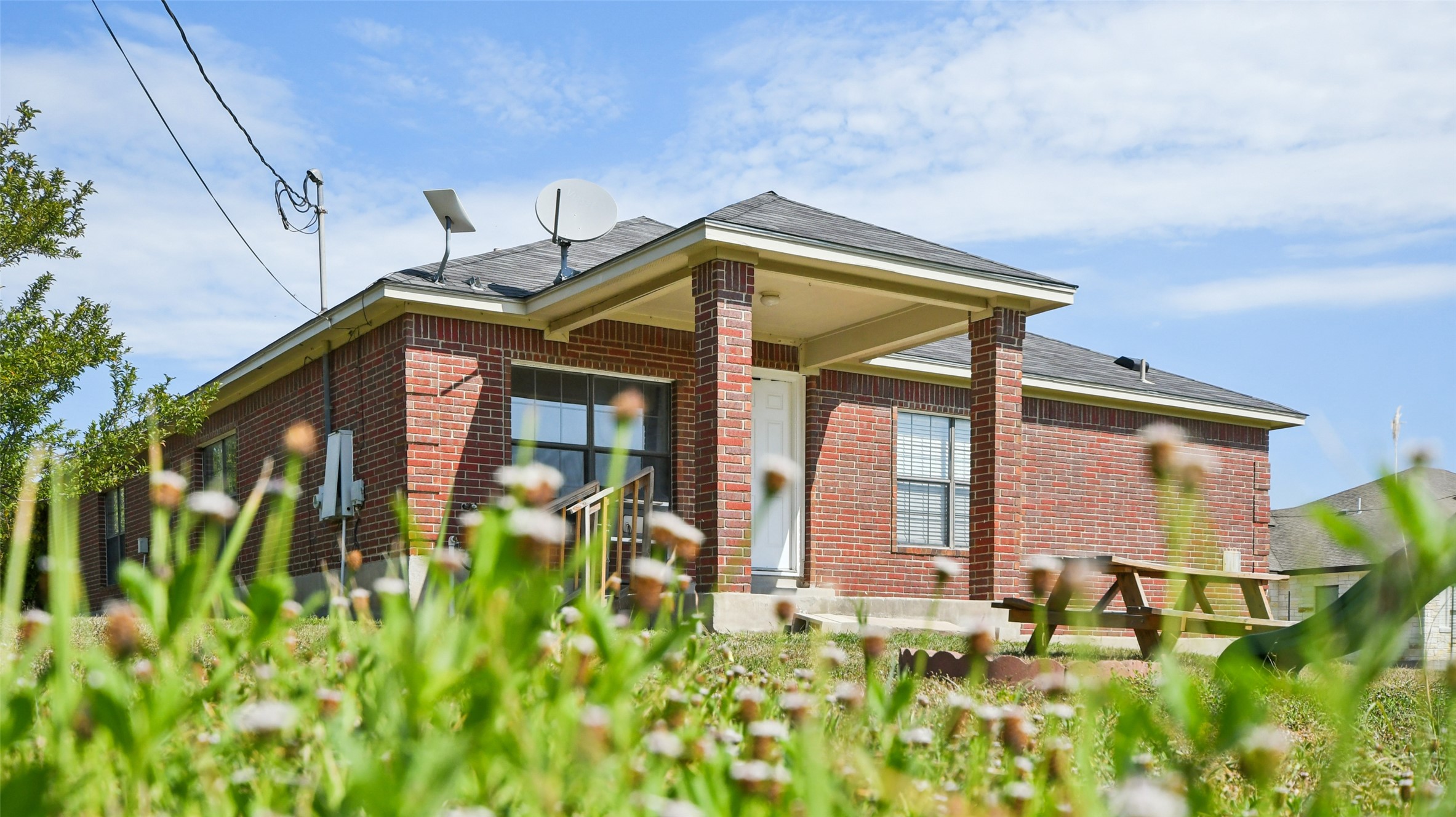 13131 Crane Road Buda, TX 78610 - Photo 18 of 18 a front view of a house with garden