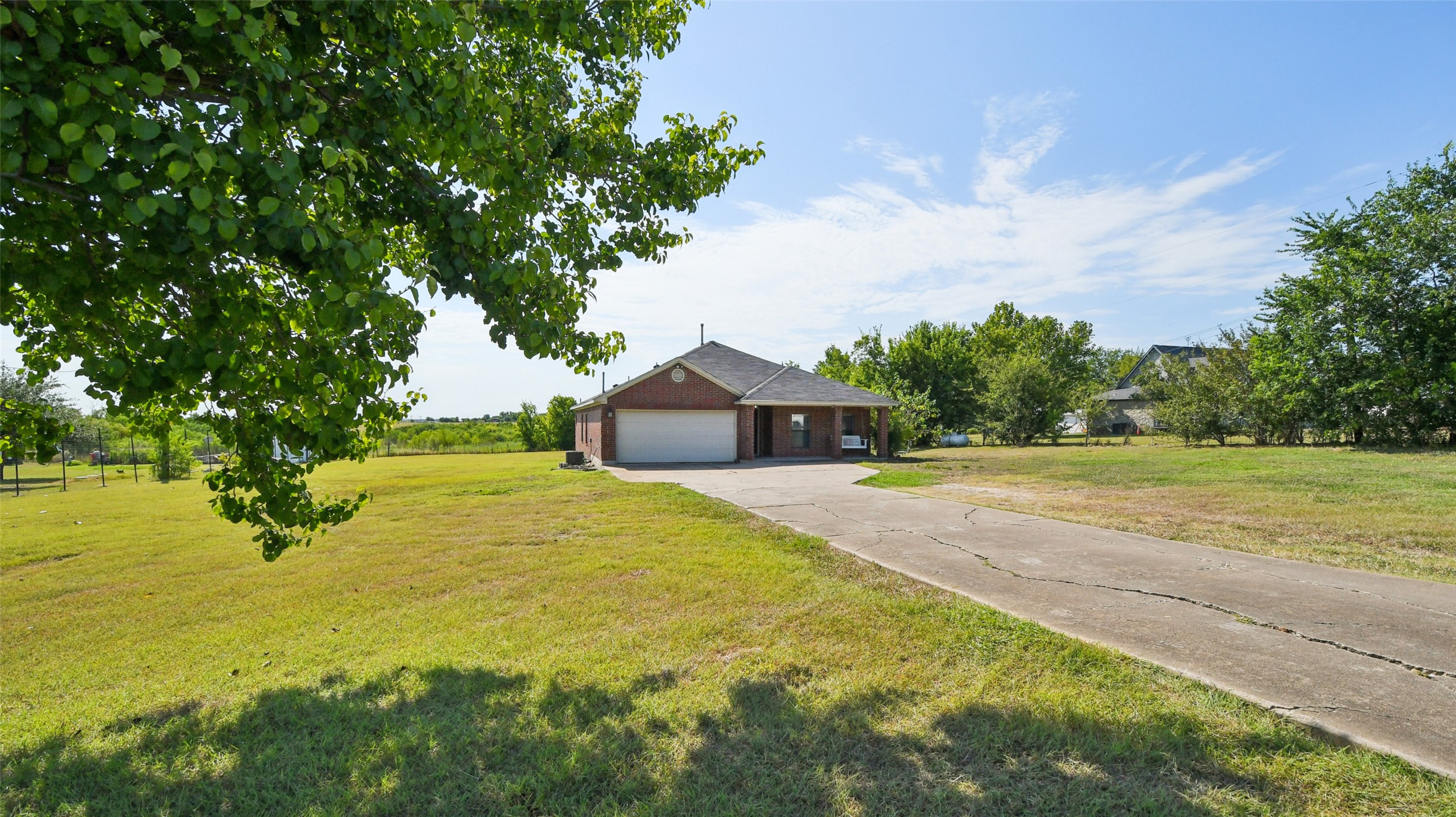 13131 Crane Road Buda, TX 78610 - Photo 2 of 18 a house with swimming pool in front of it
