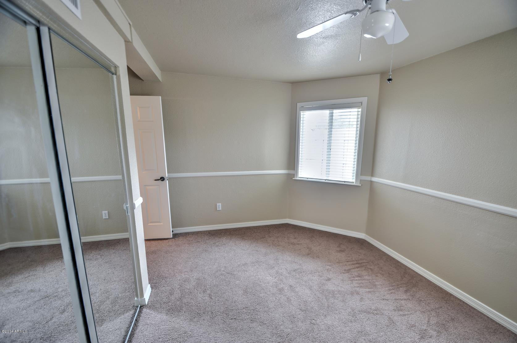 4211 East Carson Road Phoenix, AZ 85042 - Photo 16 of 19 an empty room with windows