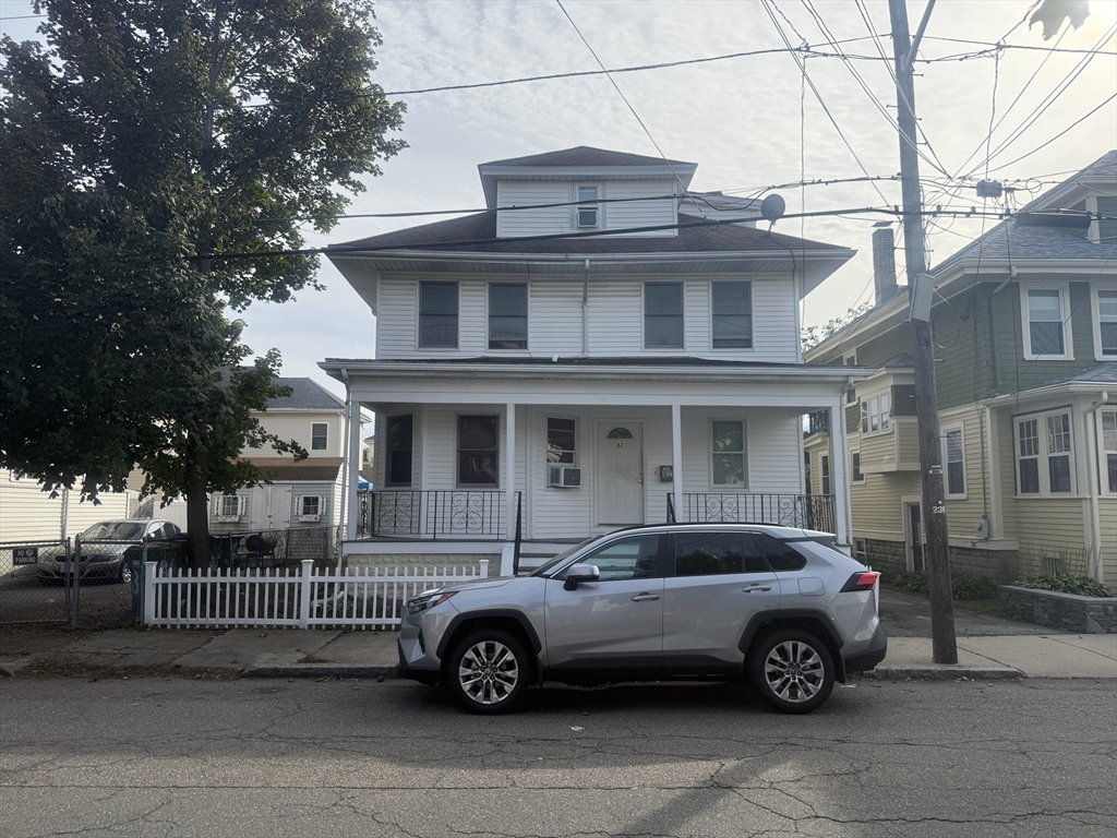 82 2nd Street Medford, MA 02155 - Photo 1 of 23 a front view of a house with a parking space