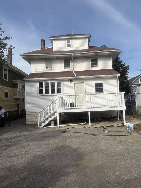 82 2nd Street Medford, MA 02155 - Photo 2 of 23 a front view of a house with garage