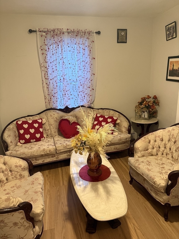82 2nd Street Medford, MA 02155 - Photo 4 of 23 a bedroom with two beds and a chair