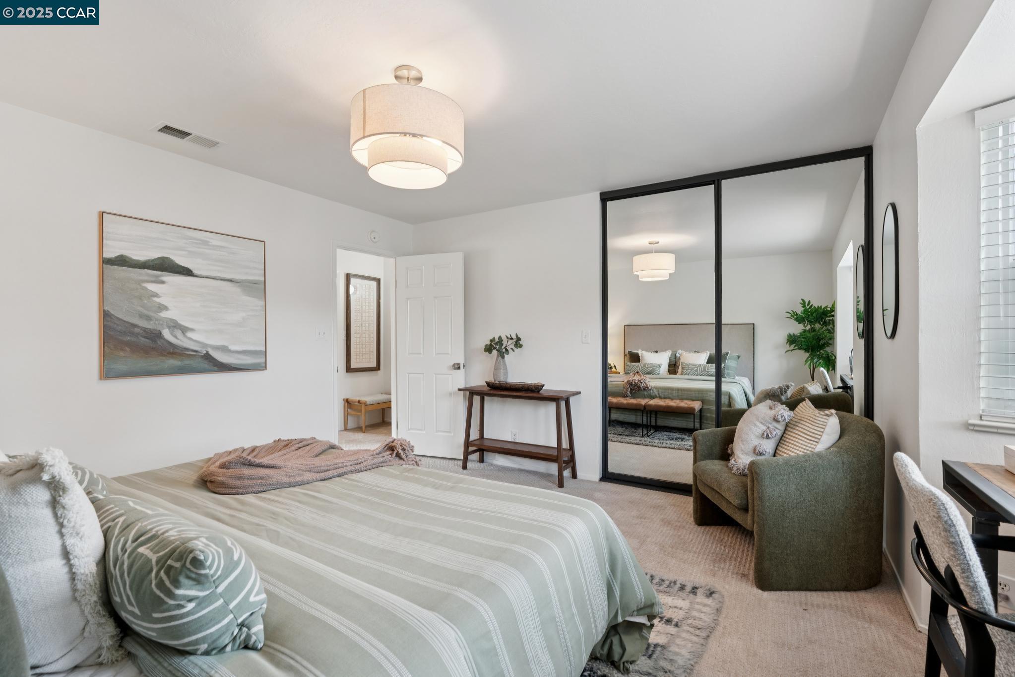 46 Sierra Lane Walnut Creek, CA 94596 - Photo 17 of 31 a bedroom with a bed and a chandelier