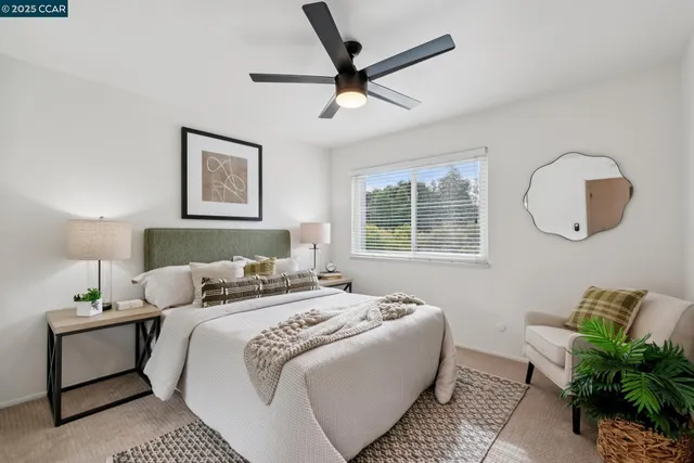 a bedroom with bed and a window