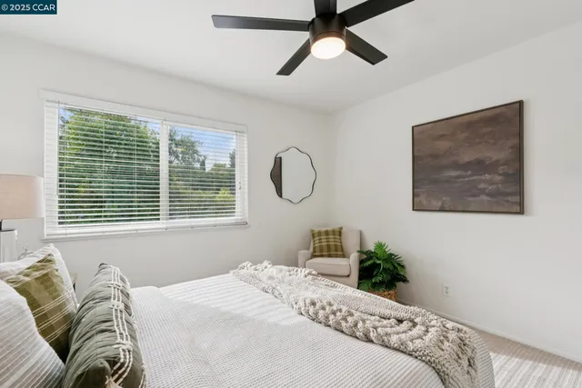 a bedroom with bed and a window