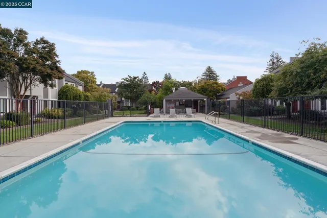 a view of swimming pool with a yard
