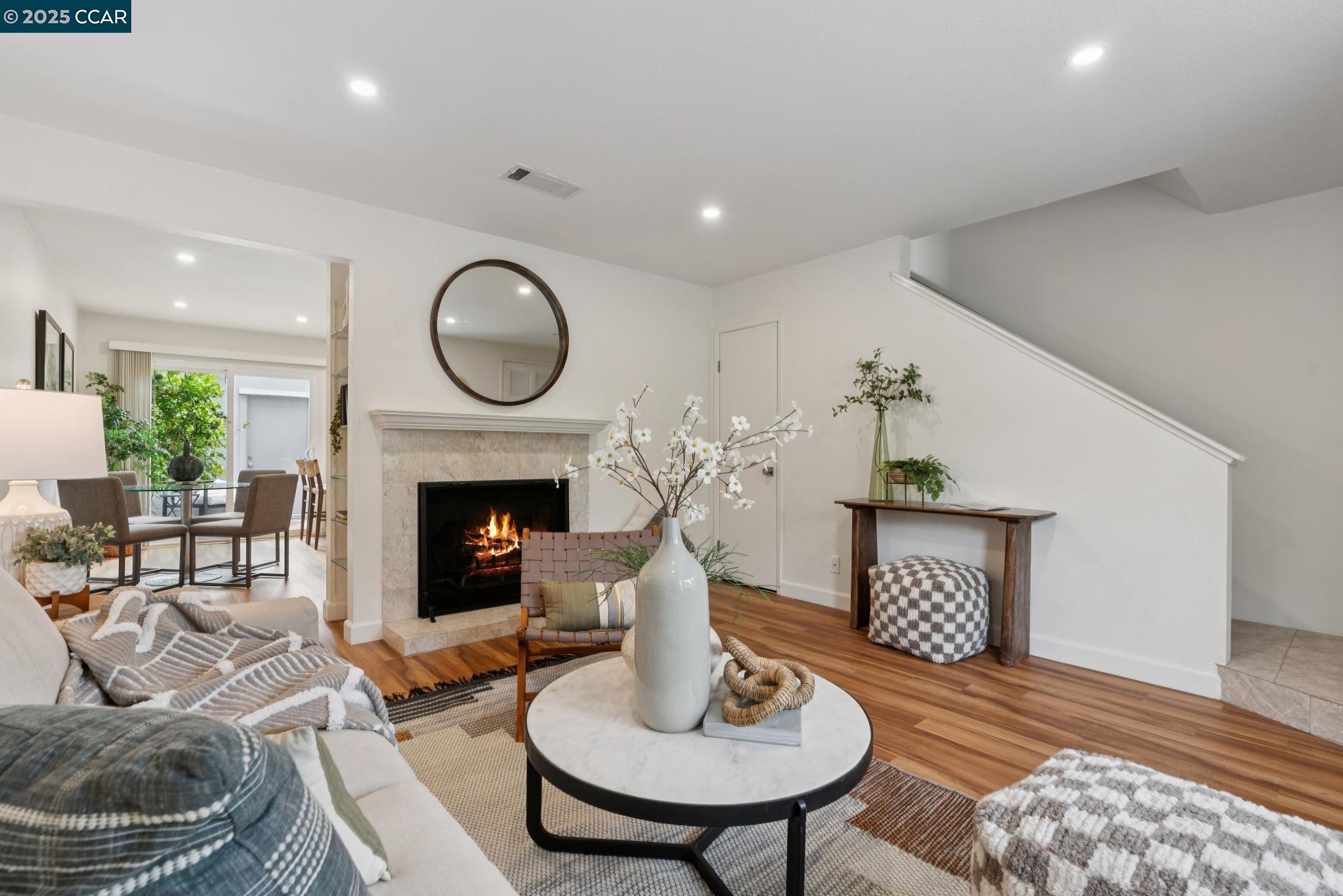 46 Sierra Lane Walnut Creek, CA 94596 - Photo 4 of 31 a living room with furniture a fireplace and a table