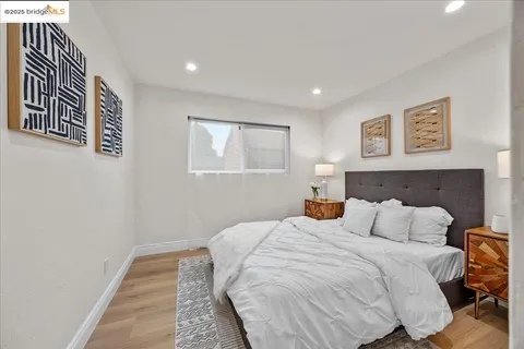 a view of a hallway with wooden cabinets and staircase