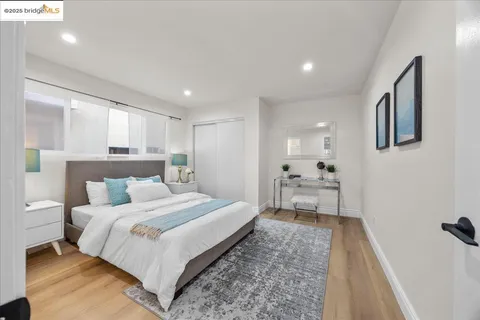 a bedroom with a large bed and a couch