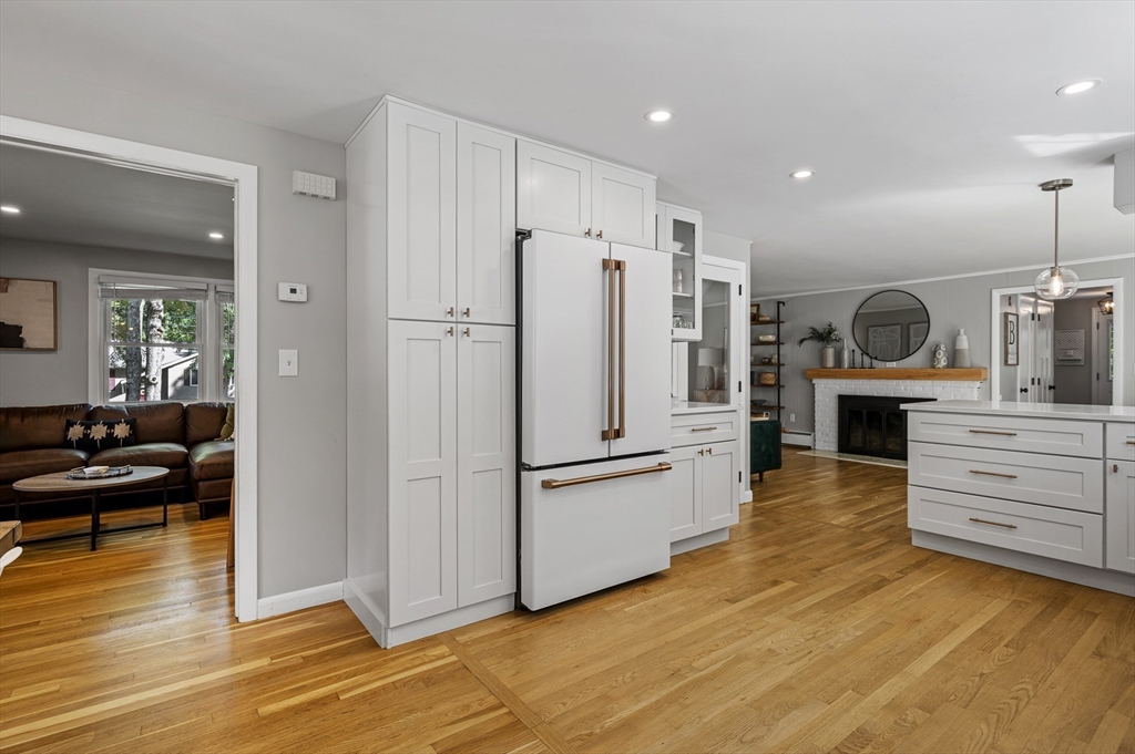 92 Dodge Hill Road Sutton, MA 01590 - Photo 8 of 33 a kitchen with a refrigerator and a stove top oven