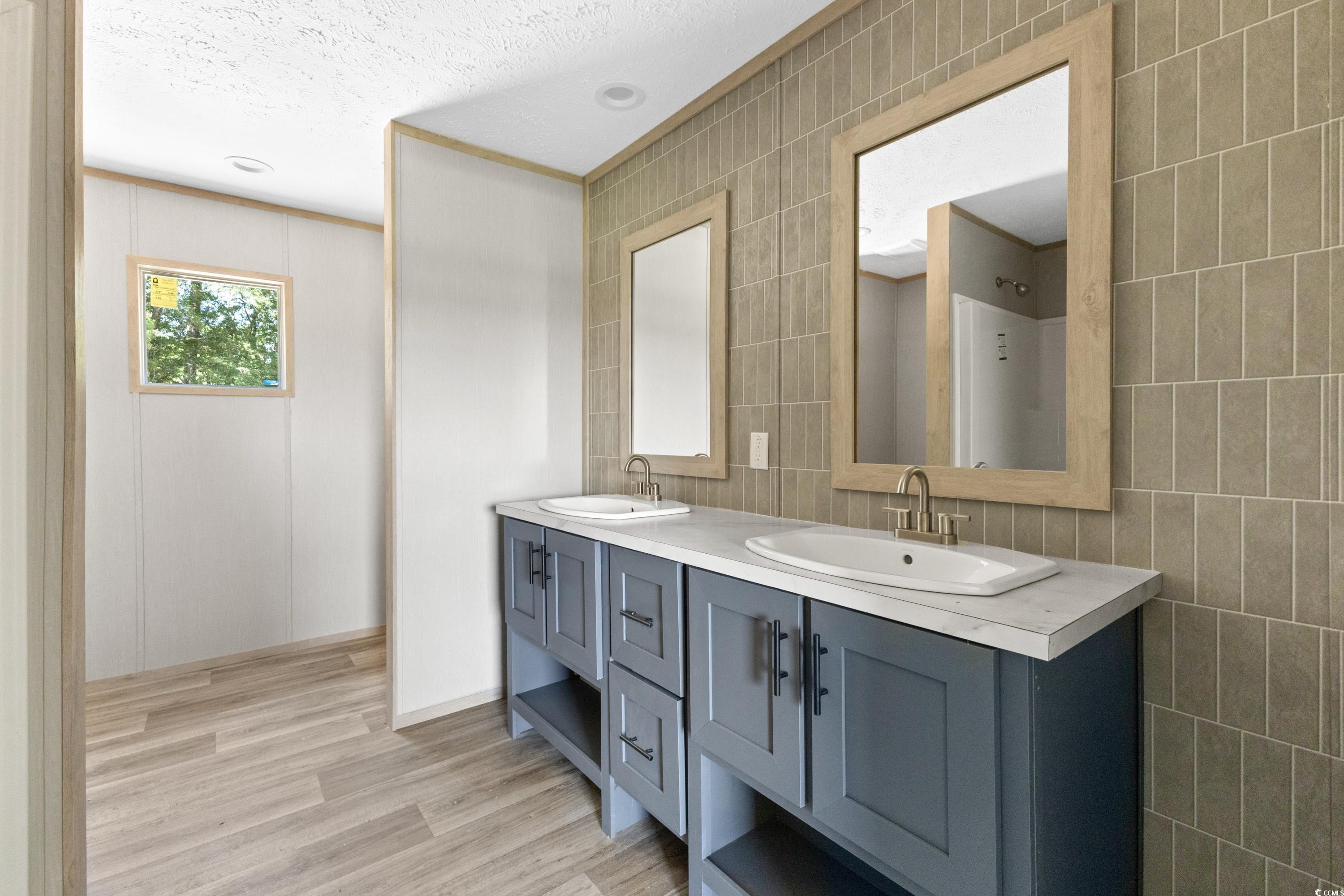5421 Carroll Todd Road Conway, SC 29526 - Photo 11 of 23 Bathroom featuring tile walls, a textured ceiling,