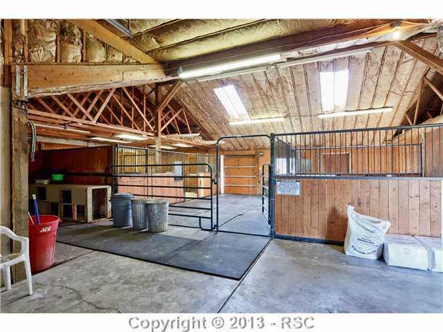 14575 Raton Road Colorado Springs, CO 80921 - Photo 16 of 25 Huge 4 stall barn is heated, has indoor plumbing, bathroom, washer and dryer, and RV or Boat Storage with Dump. Horse Lovers dream.
