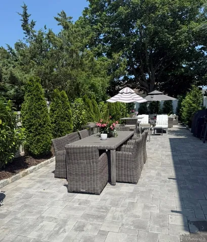 a view of a patio with chairs and a fire pit