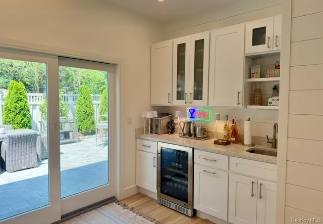 a kitchen with cabinets and window