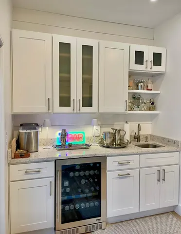 a kitchen with stainless steel appliances granite countertop a stove sink and cabinets