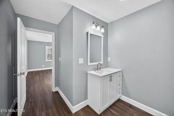 a view of a bathroom from a hallway