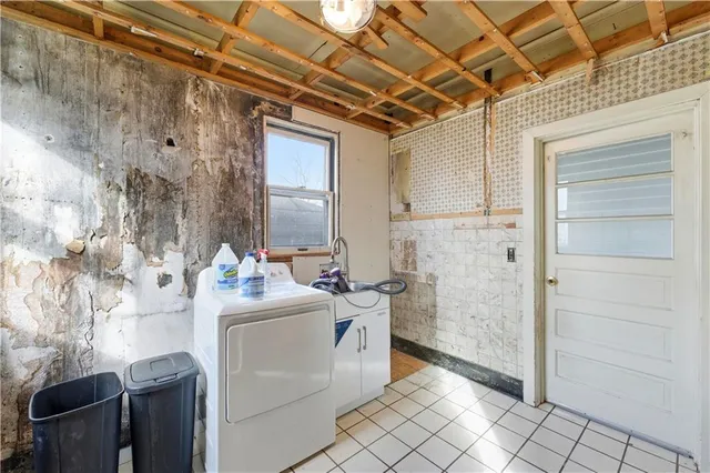 a utility room with dryer and washer