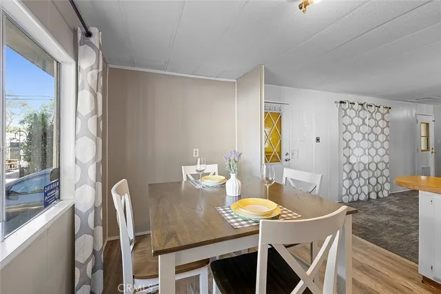 a view of a dining room with furniture and window