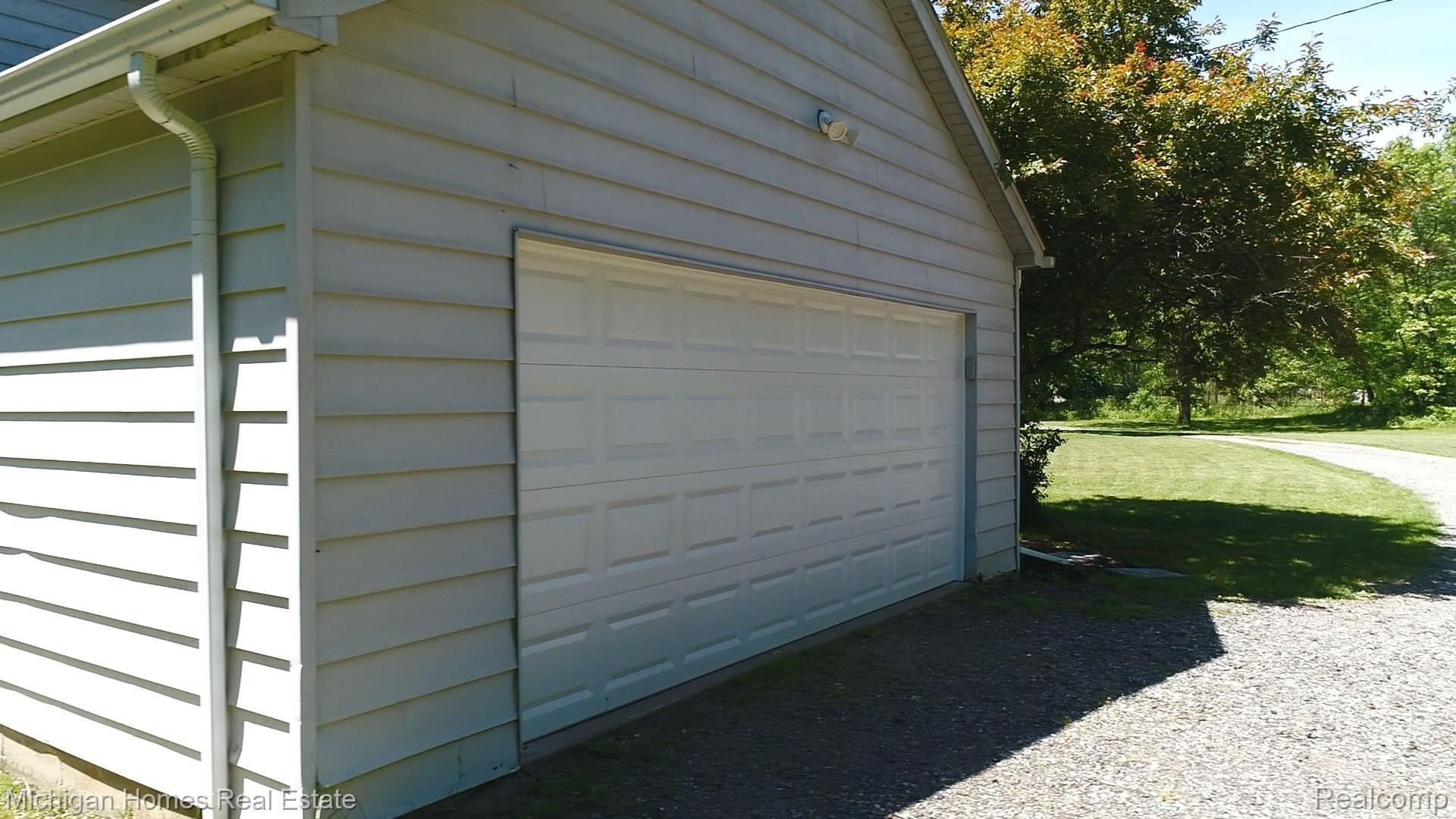 9198 Gould Road Linden, MI 48451 - Photo 52 of 56 SIDE ENTRANCE 2 CAR GARAGE