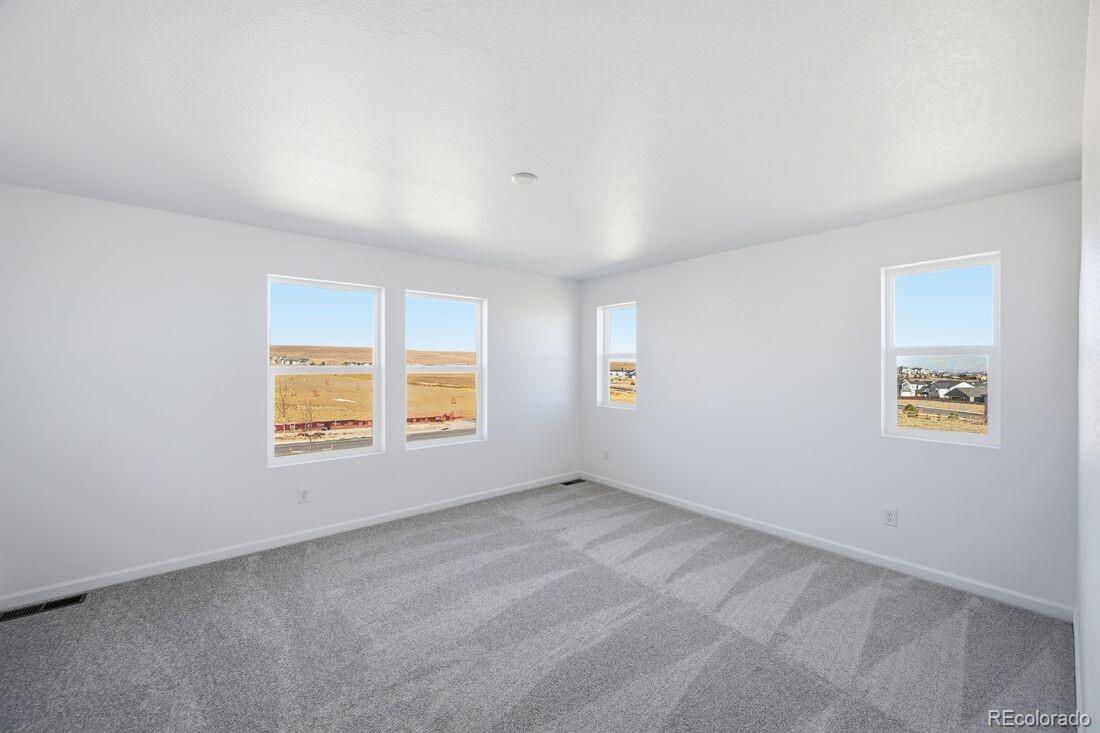 16857 West 92nd Loop Arvada, CO 80007 - Photo 13 of 31 an empty room with a window