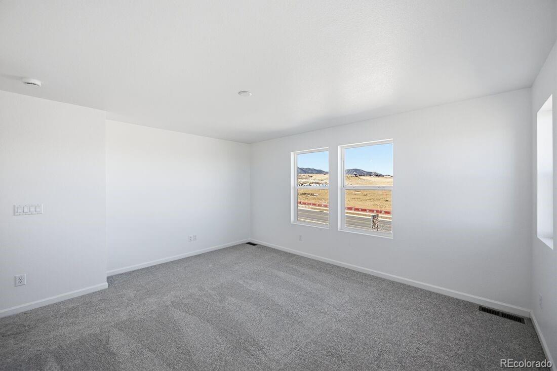 16857 West 92nd Loop Arvada, CO 80007 - Photo 14 of 31 an empty room with a window
