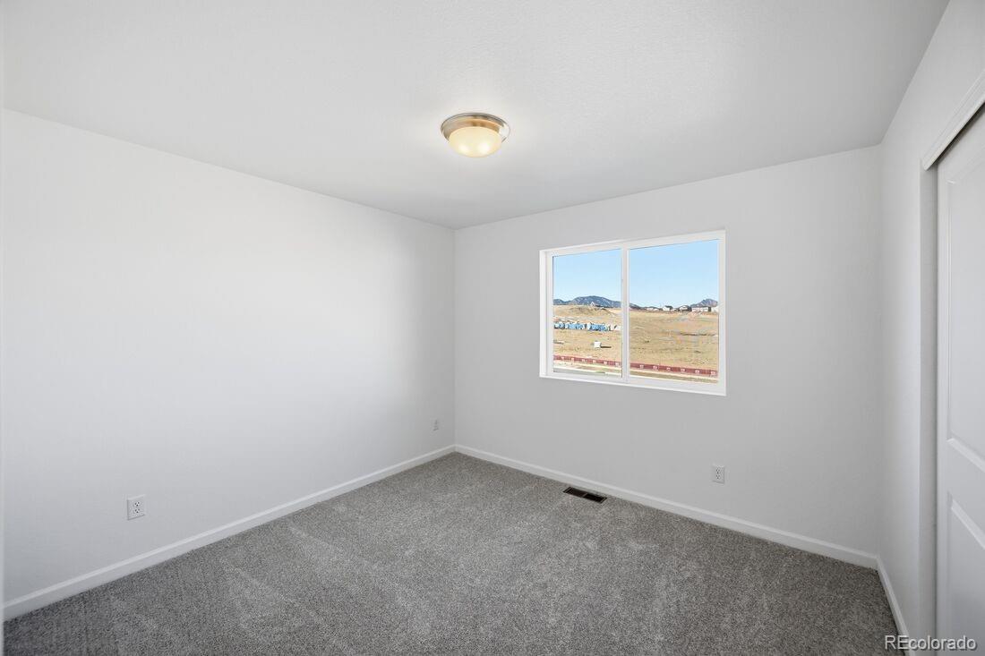 16857 West 92nd Loop Arvada, CO 80007 - Photo 21 of 31 an empty room with a window