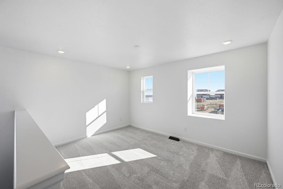 16857 West 92nd Loop Arvada, CO 80007 - Photo 25 of 31 a view of an empty room with a window