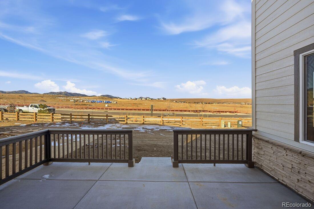 16857 West 92nd Loop Arvada, CO 80007 - Photo 3 of 31 a balcony with an ocean view