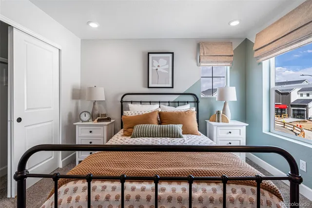 a bedroom with furniture and a window