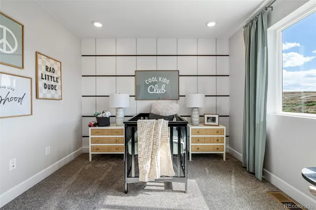 a view of a swimming pool with outdoor seating