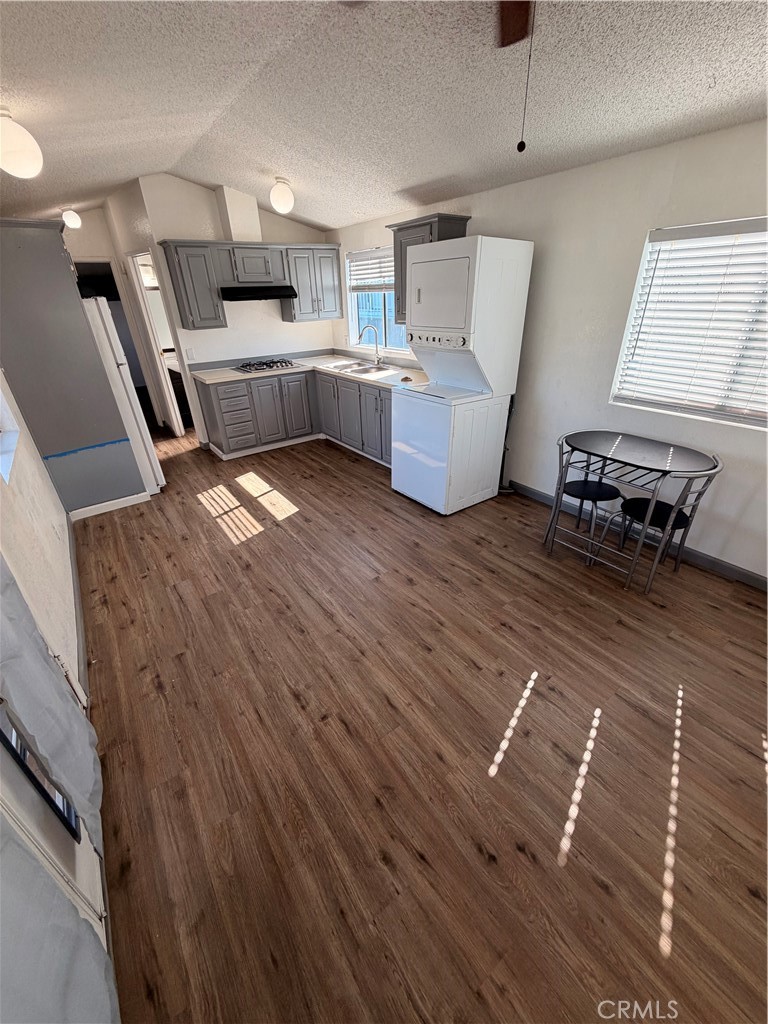 16511 Garfield Avenue, Unit D40 Paramount, CA 90723 - Photo 4 of 18 a kitchen with a sink appliances and cabinets