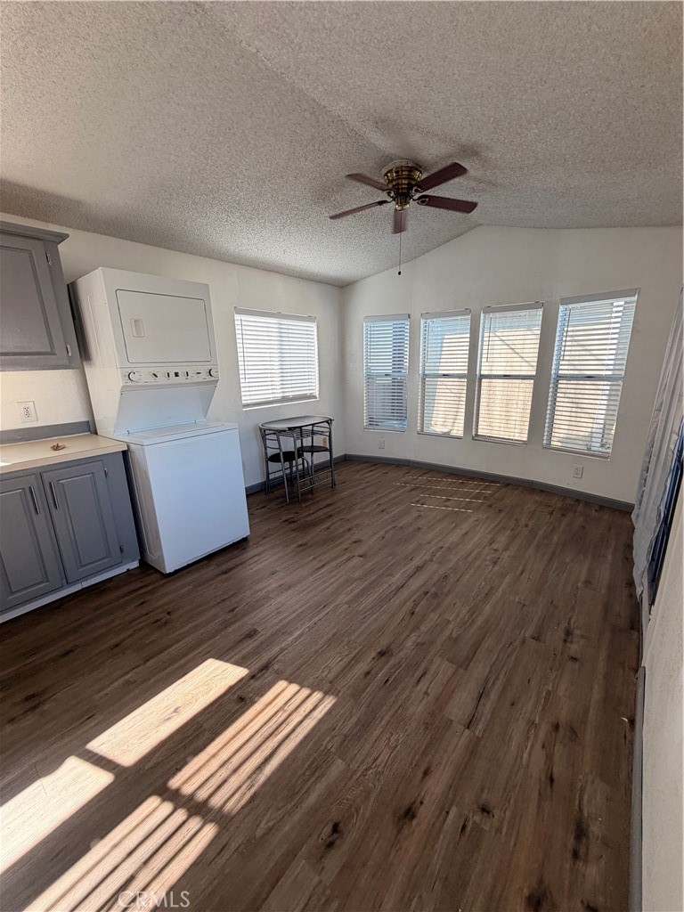 16511 Garfield Avenue, Unit D40 Paramount, CA 90723 - Photo 5 of 18 an empty room with wooden floor and windows