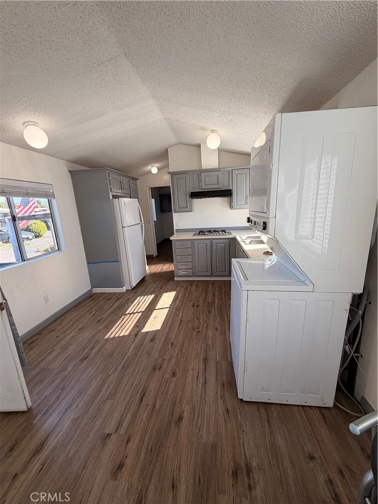 16511 Garfield Avenue, Unit D40 Paramount, CA 90723 - Photo 6 of 18 a room with wooden floors and white walls
